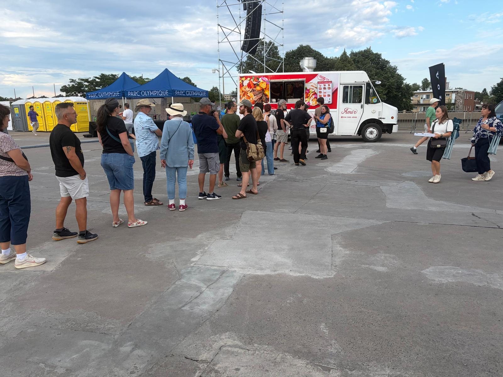 Amir Express food truck serving a lineup at an event
