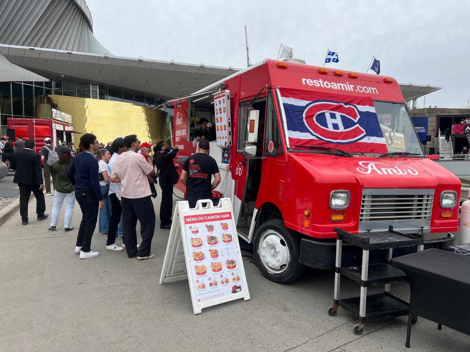 Amir food truck with a customer lineup